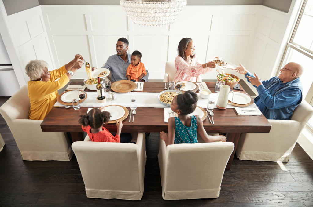 Family having breakfast at the dining table | H&R Carpets & Flooring
