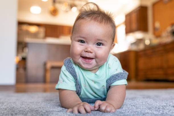 baby lying on carpet floor | H&R Carpets & Flooring